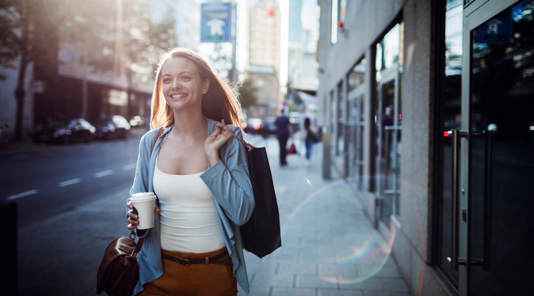 Your Address Says it All lifestyle image of a woman walking through a city environment